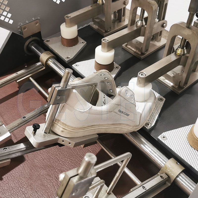 What are the structural components of the shoe flexing testing machine